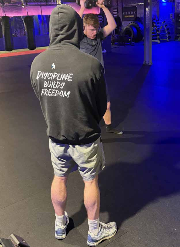 Training in an Iron Minds hoodie