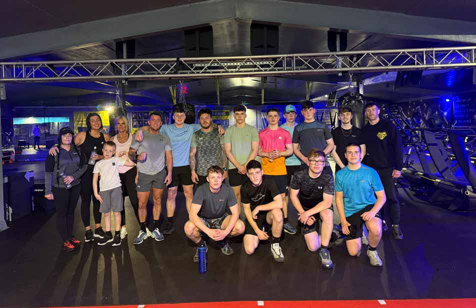 Group gathered at a boxing gym