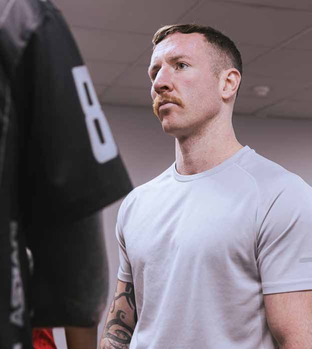 Roy Bannister beside a punching bag